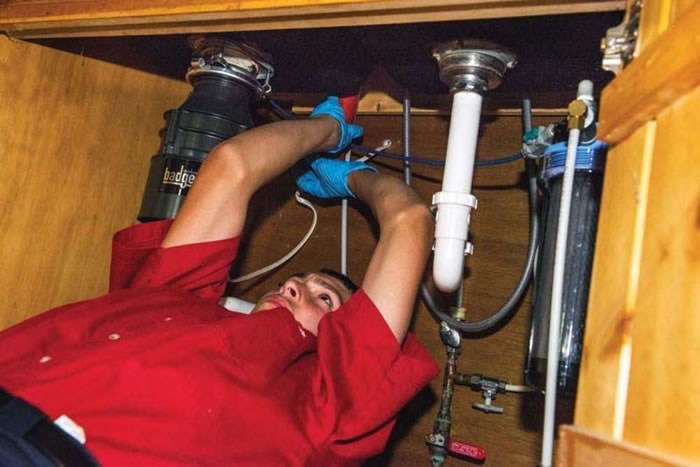 Can a Plumber Fix Any Garbage Disposal Brand?
